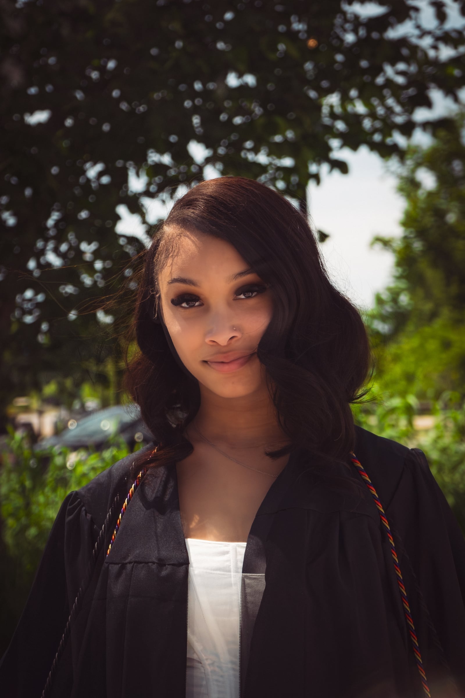 Graduate in cap and gown, portrait session